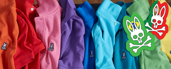 Row of brightly colored Psycho Bunny polo shirts featuring the embroidered bunny and crossbones logo, with two custom event themed Psycho Bunny stickers displayed on the right.