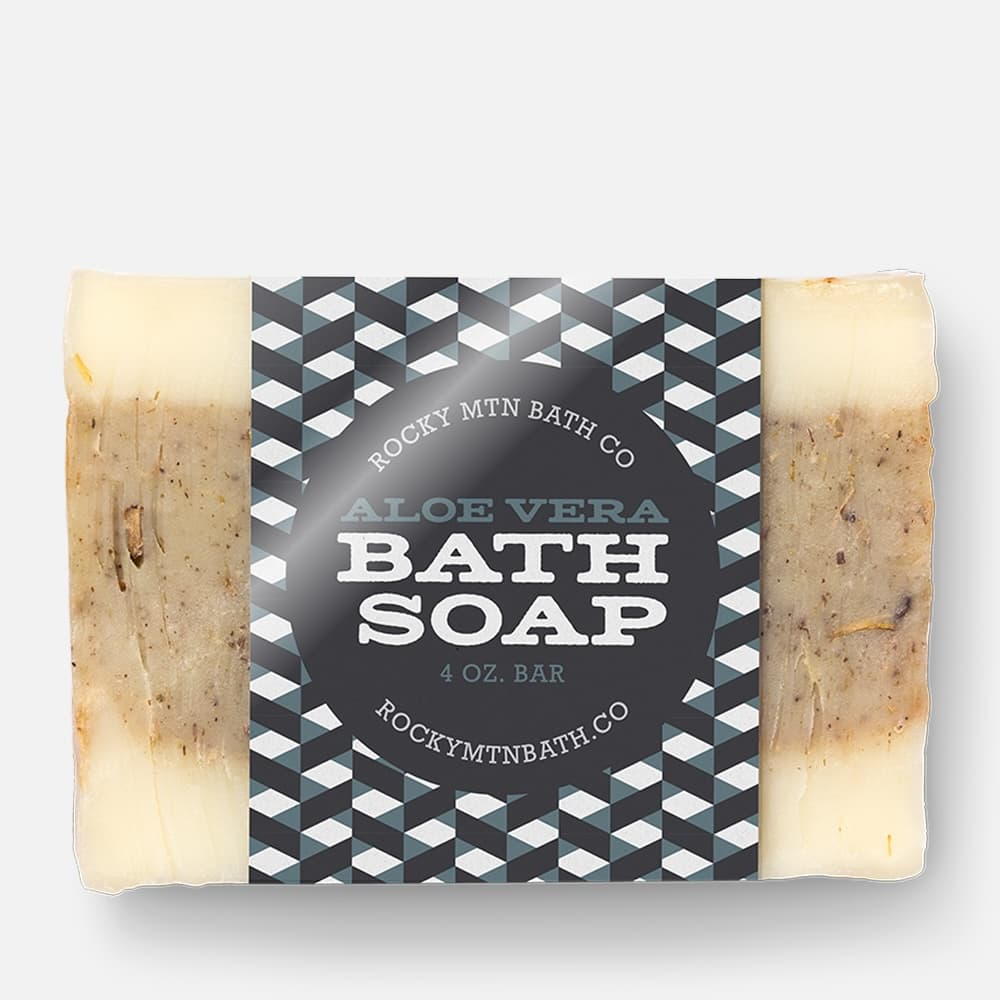 Custom glossy paper labels wrapped around handmade aloe vera bath soap bars with a high-shine finish.