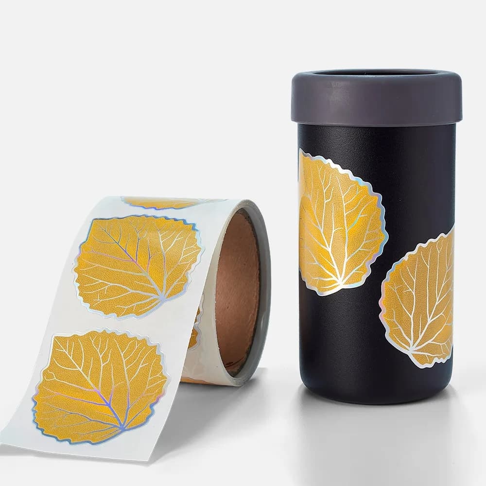 Holographic kiss cut stickers on a roll applied to reusable product packaging.