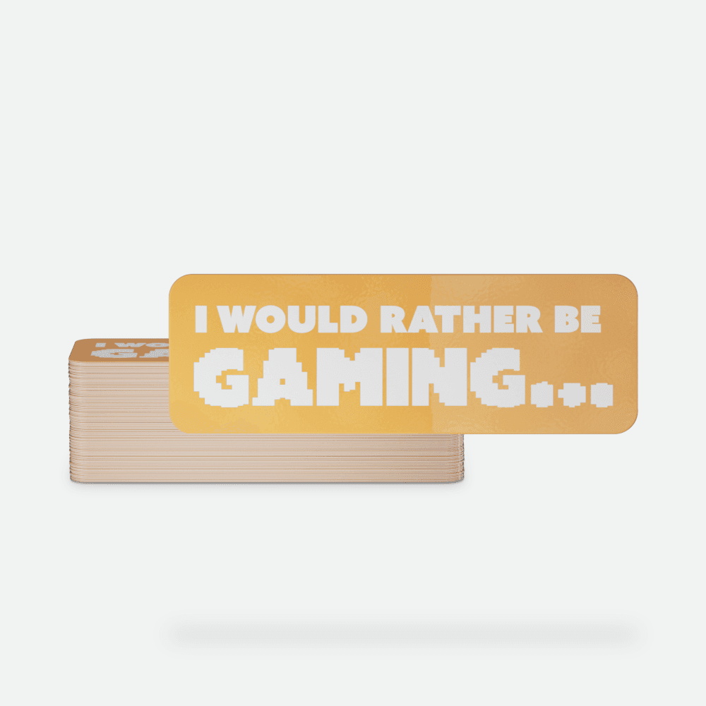 Gold rectangular sticker with white pixel-style text reading “I WOULD RATHER BE GAMING…” displayed in a stack of custom rectangle stickers.