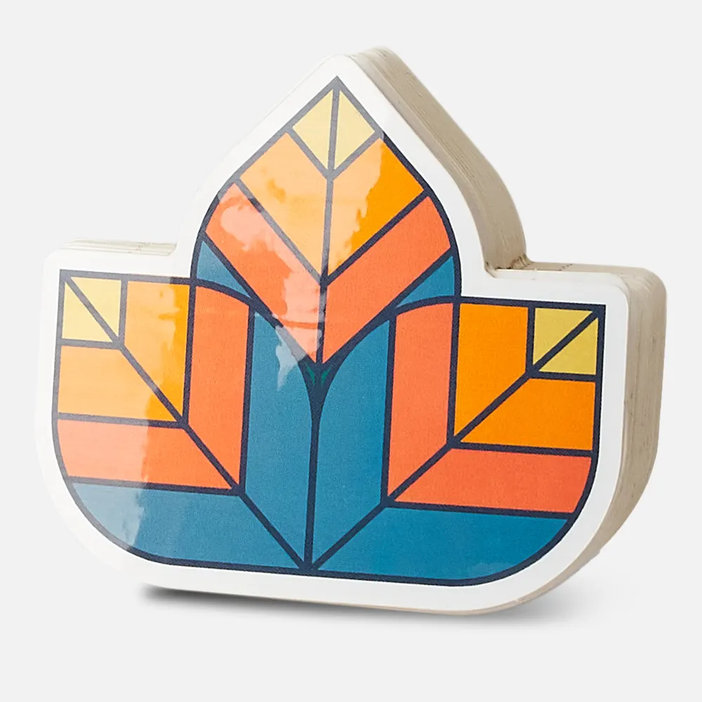 A stack of leaf-shaped die cut stickers printed by StickerGiant