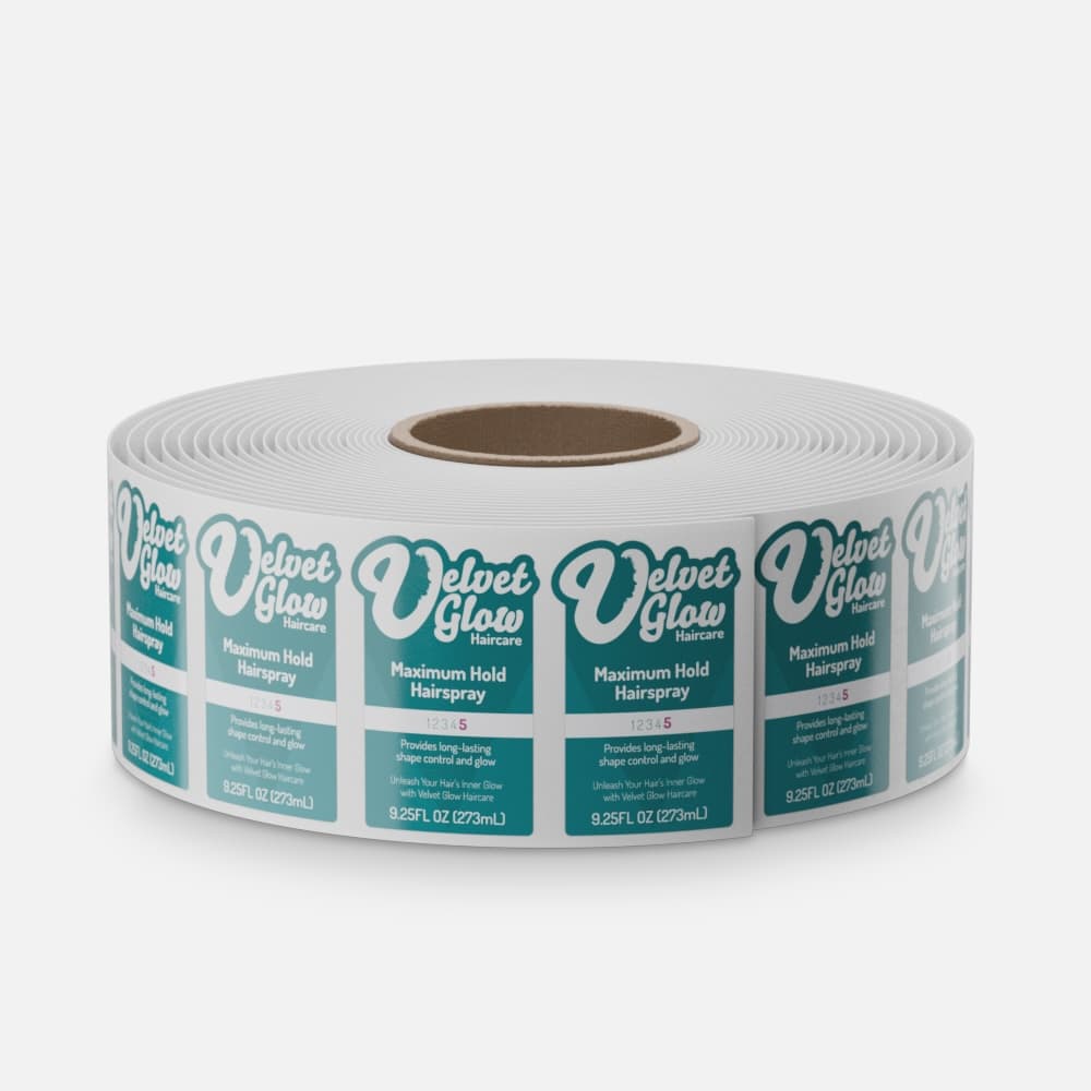 Roll of custom glossy paper labels for Velvet Glow hairspray with a high-shine finish and teal product design.