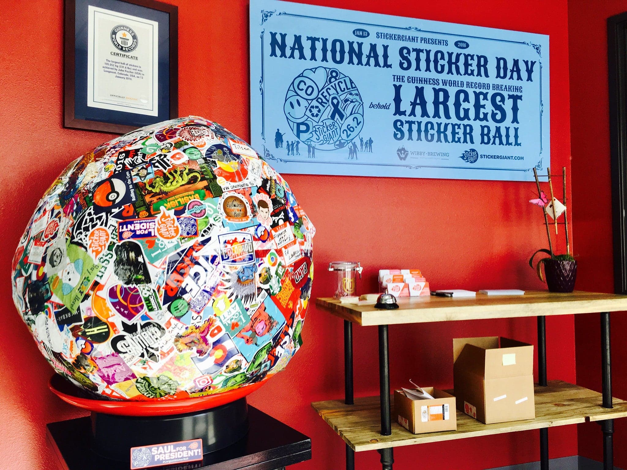 Saul the Sticker Ball on a scale at the National Sticker Day Guiness Book World Record weigh in