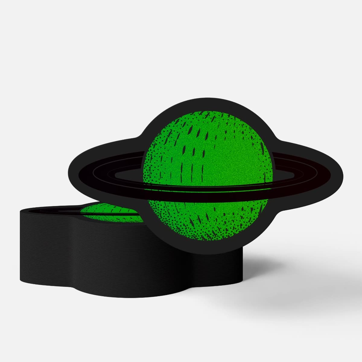 A stack of Glow in the Dark Stickers printed by StickerGiant glowing