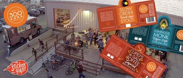 Outdoor scene at 300 Suns Brewing with StickerGiant printed beer labels shown for their bottled releases.