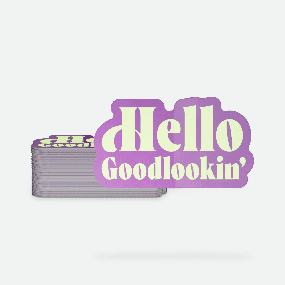 A stack of 'Hello Goodlookin' Glow in the Dark Stickers printed by StickerGiant