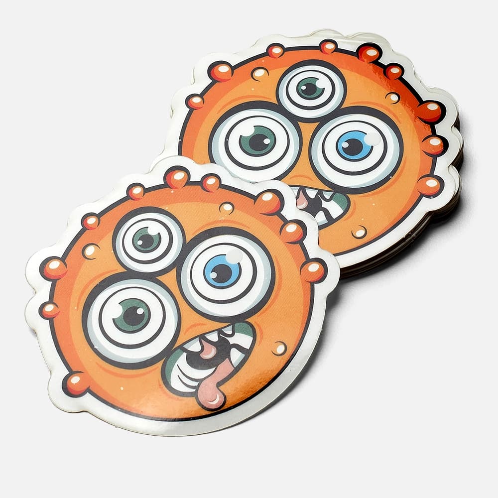 A stack of monster shaped glow in the dark stickers printed by StickerGiant without the glow effect
