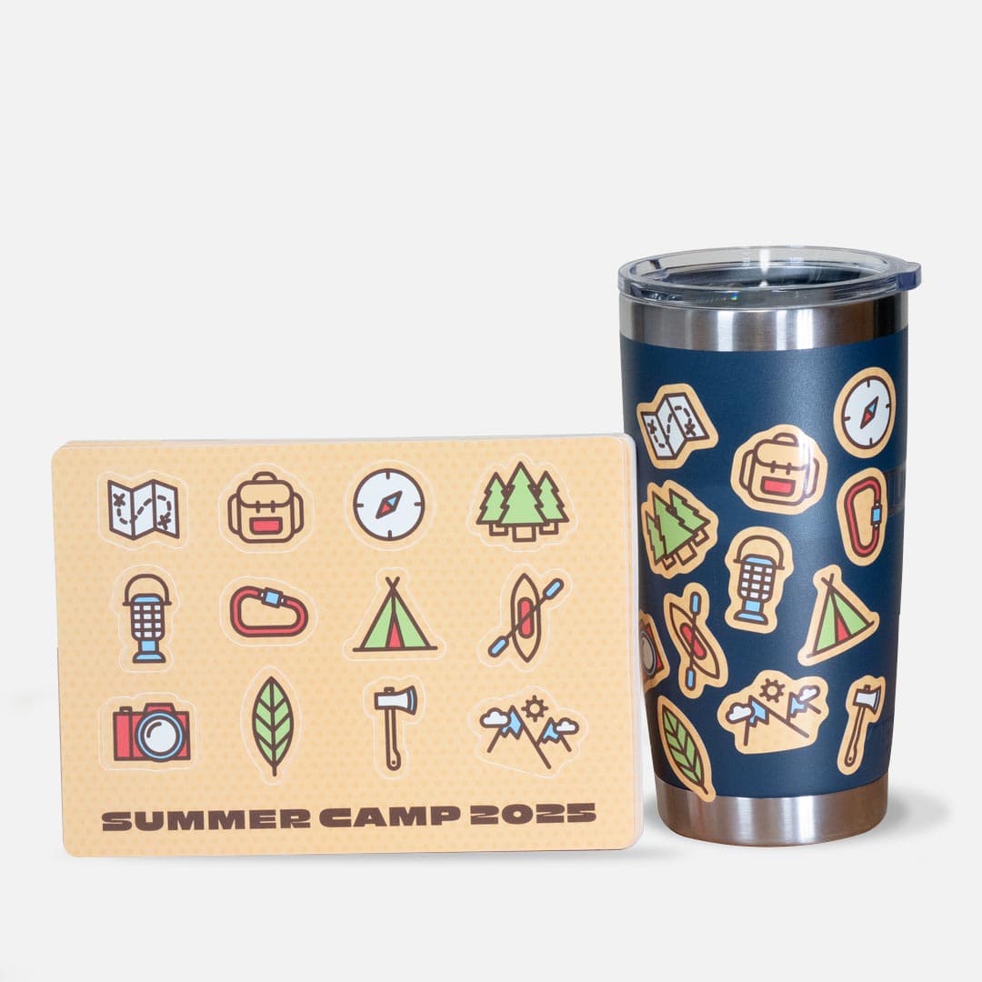 Custom sticker sheet with summer camp-themed designs applied to a tumbler, featuring icons like tents, trees, and compasses.